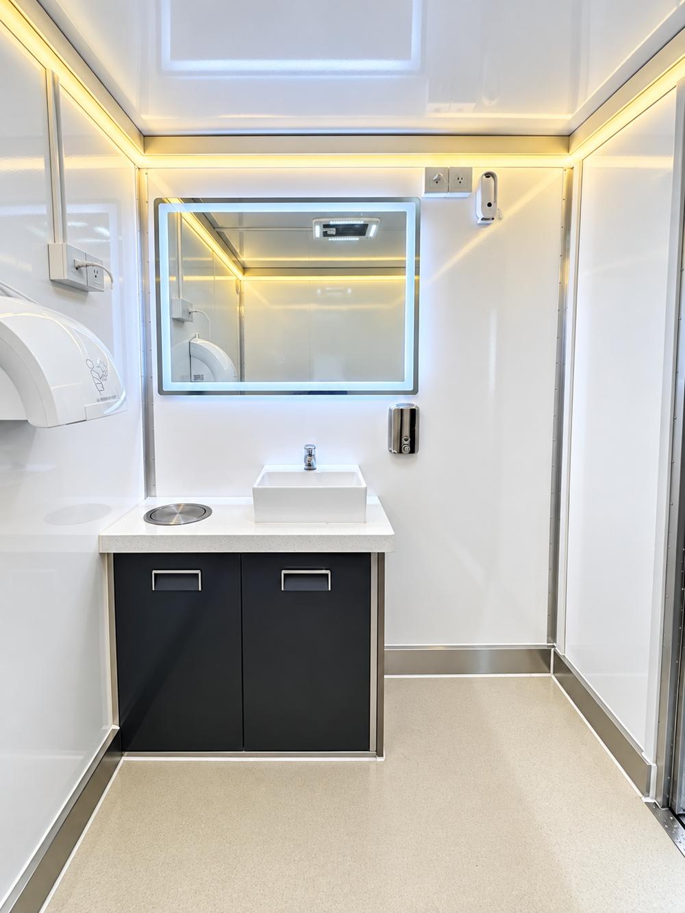 Luxury restroom shower trailer sink area