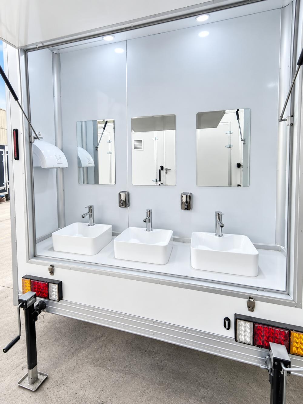Shower trailer sink and mirror area